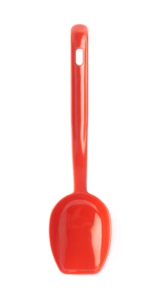 Colher de cozinha de plástico vermelho — Fotografia de Stock