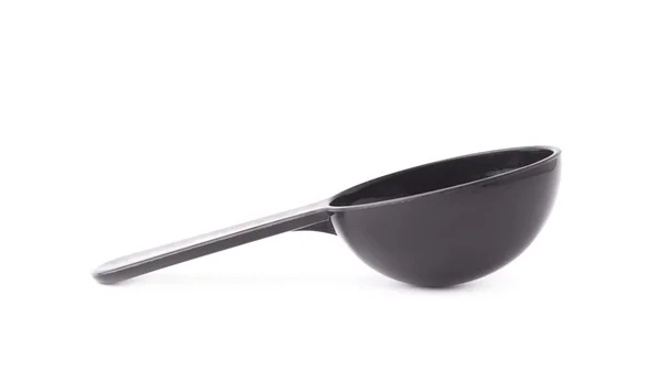 Black plastic measure spoon — Stock Photo, Image