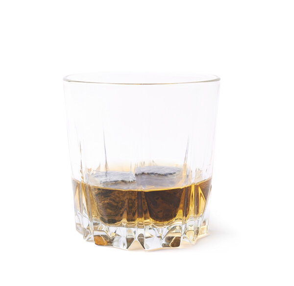 Glass tumbler filled with whiskey
