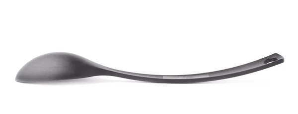 Black plastic kitchen ladle spoon — Stock Photo, Image