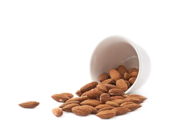 Cup full of almond seeds — Stock Photo, Image