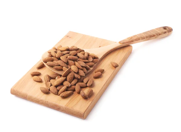 Wooden spoon covered with almonds — Stock Photo, Image