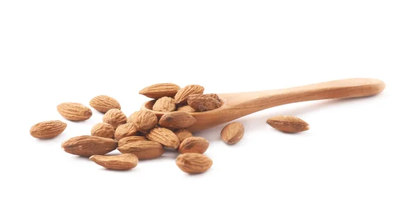 Spoon full of almond seeds — Stock Photo, Image