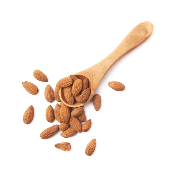 Spoon full of almond seeds — Stock Photo, Image