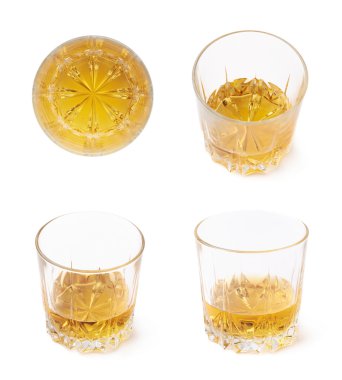 Glass tumblers filled with whiskey clipart