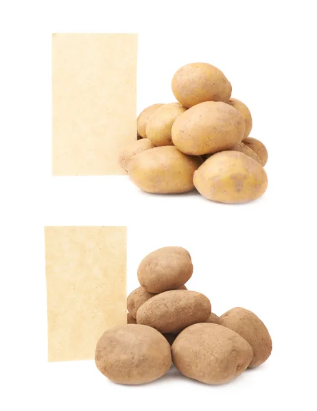 Pile of potatoes against piece of paper — Stock Photo, Image