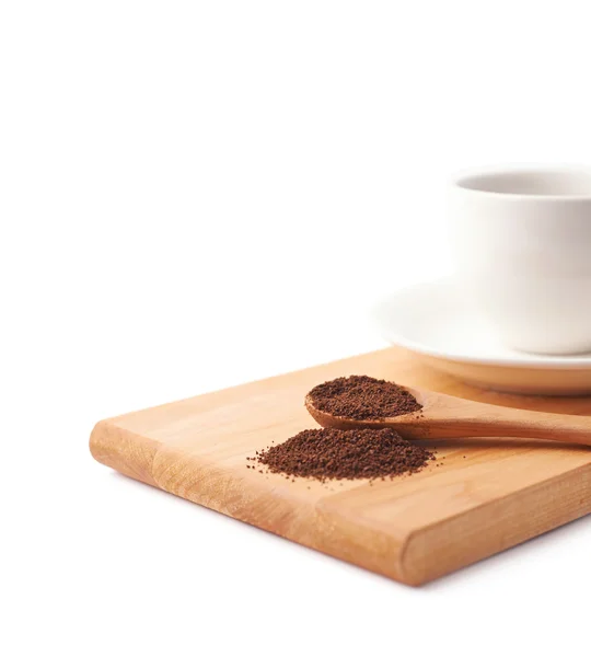 Spoon of ground coffee and cup — Stock Photo, Image