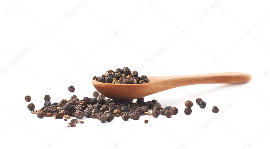 Wooden spoon and black peppercorn