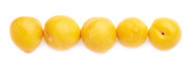 Lined up yellow plums