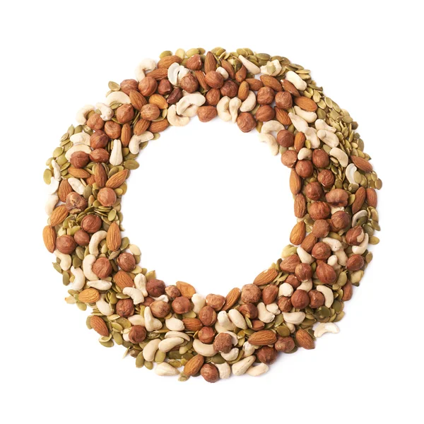 Round frame of nuts and seeds — Stock Photo, Image