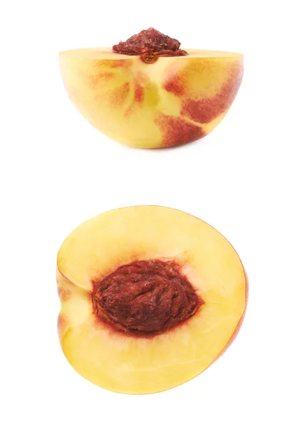 Cut open nectarine half — Stock Photo, Image