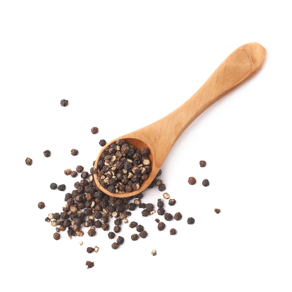 Wooden spoon and black peppercorn — Stock Photo, Image
