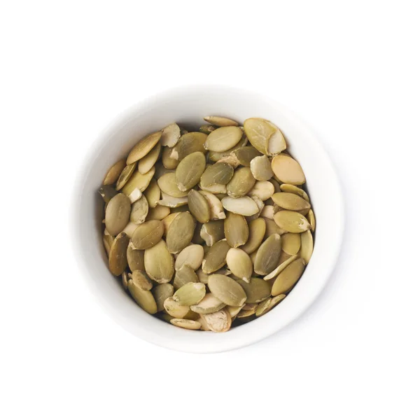 Cup with pumpkin seeds — Stock Photo, Image