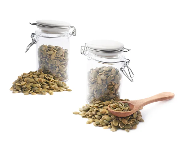 Glass jar with pumpkin seeds — Stock Photo, Image