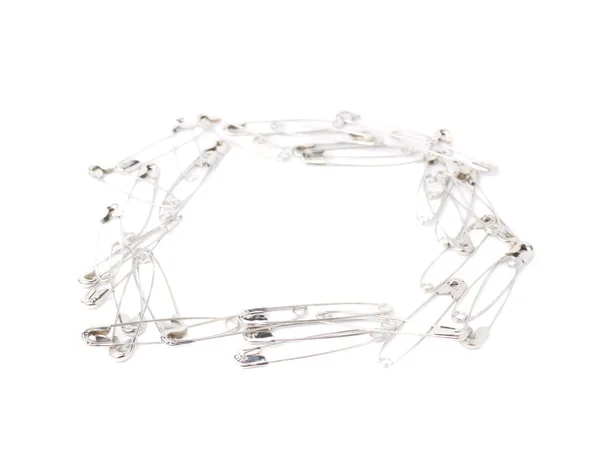 Square frame made of safety pins — Stock Photo, Image