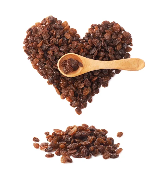 Raisins and wooden spoon — Stock Photo, Image