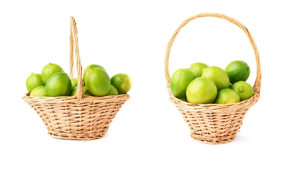 Wicker baskets with ripe limes — Stock Photo, Image