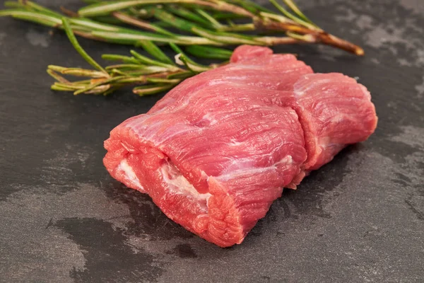 Raw beef steaks on wooden table with rosemary — Stock Photo, Image