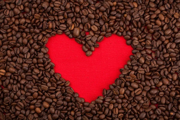 Coffee bean met rood hart voor achtergrond — Stockfoto