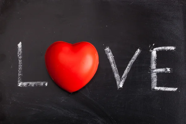 Handwritten message love on a chalkboard — Stock Photo, Image