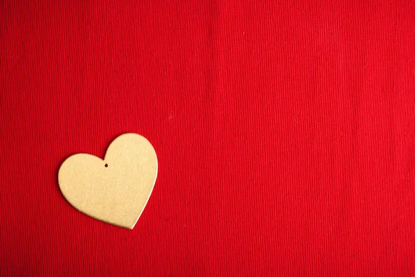 Wooden heart on red — Stock Photo, Image