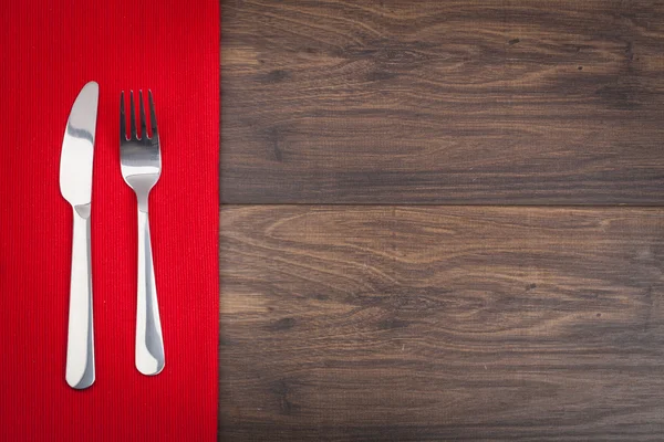 Fork and knife on wood background — Stock Photo, Image