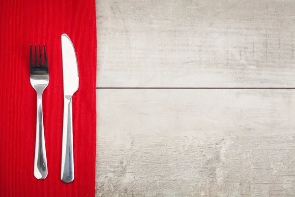 Garfo e faca na toalha de mesa — Fotografia de Stock