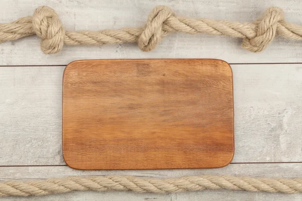 Texture of wooden boards with ship rope — Stock Photo, Image