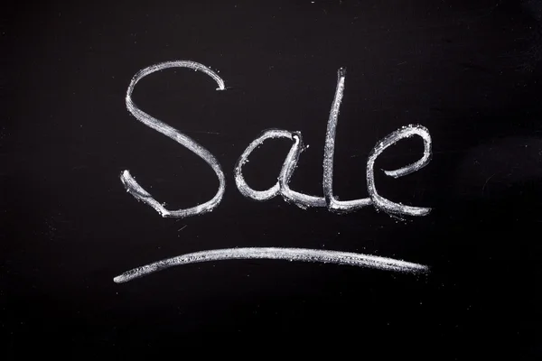Sale lettering of chalk on blackboard — Stock Photo, Image