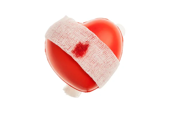 Zaczerwienione serce z bandażem — Zdjęcie stockowe