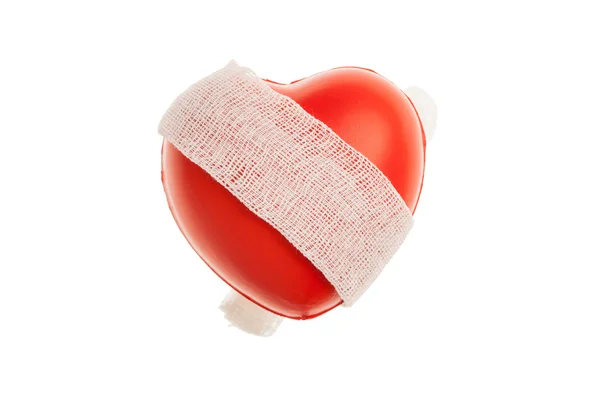 Červené srdce s obvazem — Stock fotografie