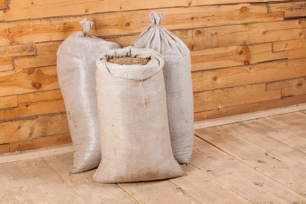 Oat grains in sack bags — Stock Photo, Image
