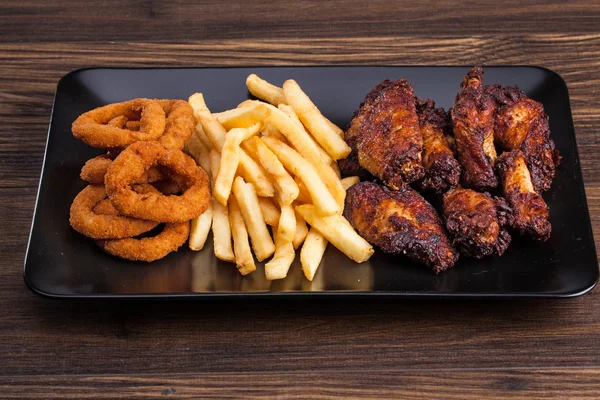 onion rings, french fries and chicken wings