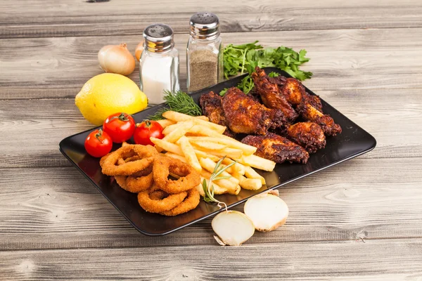 onion rings, french fries and chicken wings