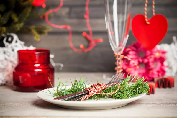 Christmas plate and pine branch — Stock Photo, Image