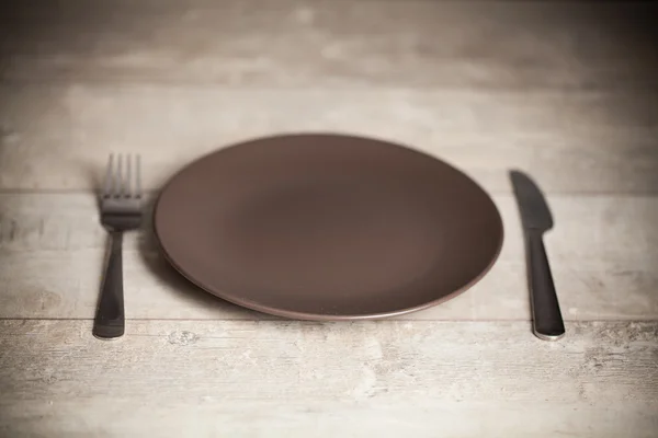 Plate with fork and knife — Stock Photo, Image