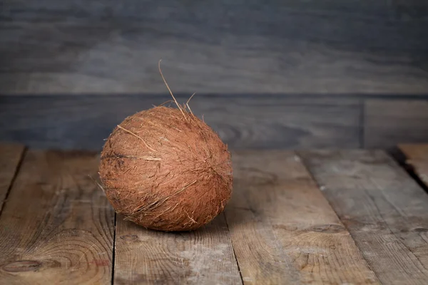 Coconut on wood rustic table — Stock Photo, Image
