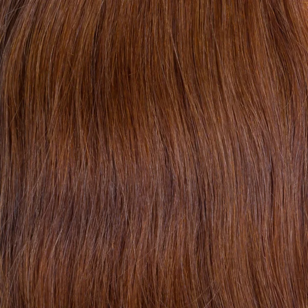 Human hair wig on a mannequin. Back view. Brunette. Straight hair