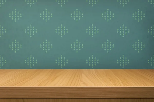 Empty wooden table over wallpaper with pattern — Stock Photo, Image