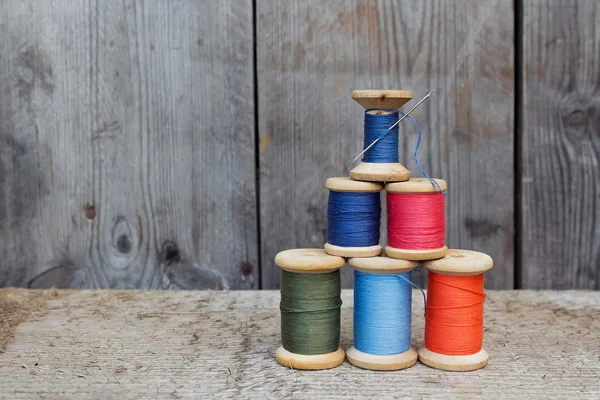 Vintage reels of thread  and needle — Stock Photo, Image