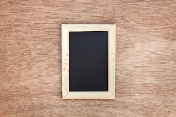 Blank chalkboard on wooden background — Stock Photo, Image