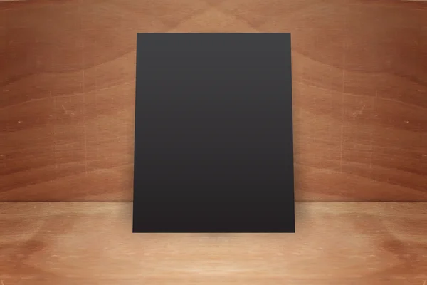 Blank poster stand on a wooden background — Stock Photo, Image