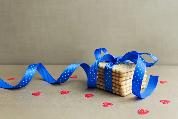 Cookies with blue ribbon — Stock Photo, Image