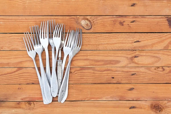 Vintage forks on wooden background — Stock Photo, Image