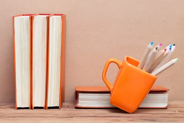 A stack of books and a mug — Stock Photo, Image