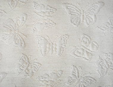 Kumaşın dokusunu. Beyaz bir yatak örtüsü üzerinde kelebekler. Tasarım için arkaplan.