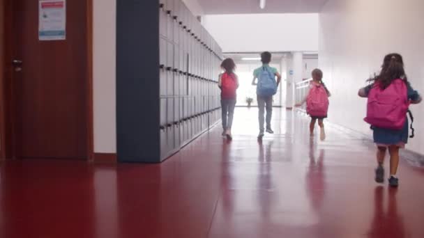 Excited schoolkids of different ages running — Stock Video