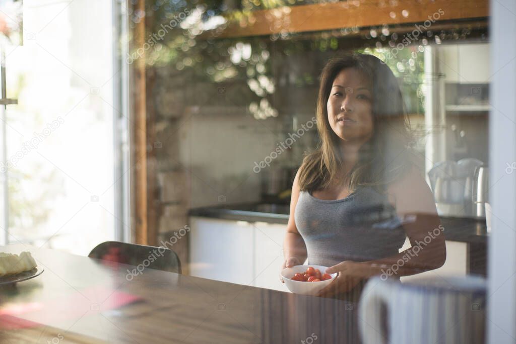 Portrait of Japanese woman in kitchen