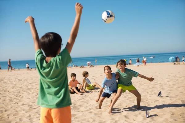 Boys fighting for ball when playing football — Stock Photo, Image