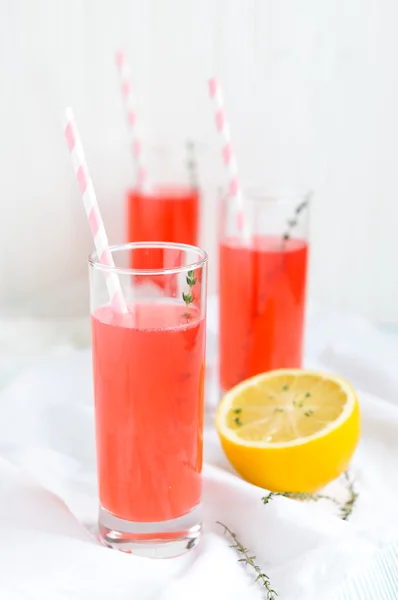Pink fruit lemonade and  lemon — Stock Photo, Image